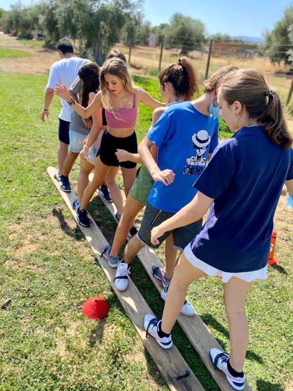 Trainees running an outdoor group activity