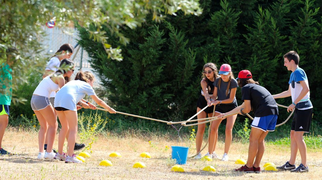 Trainees running an outdoor group activity