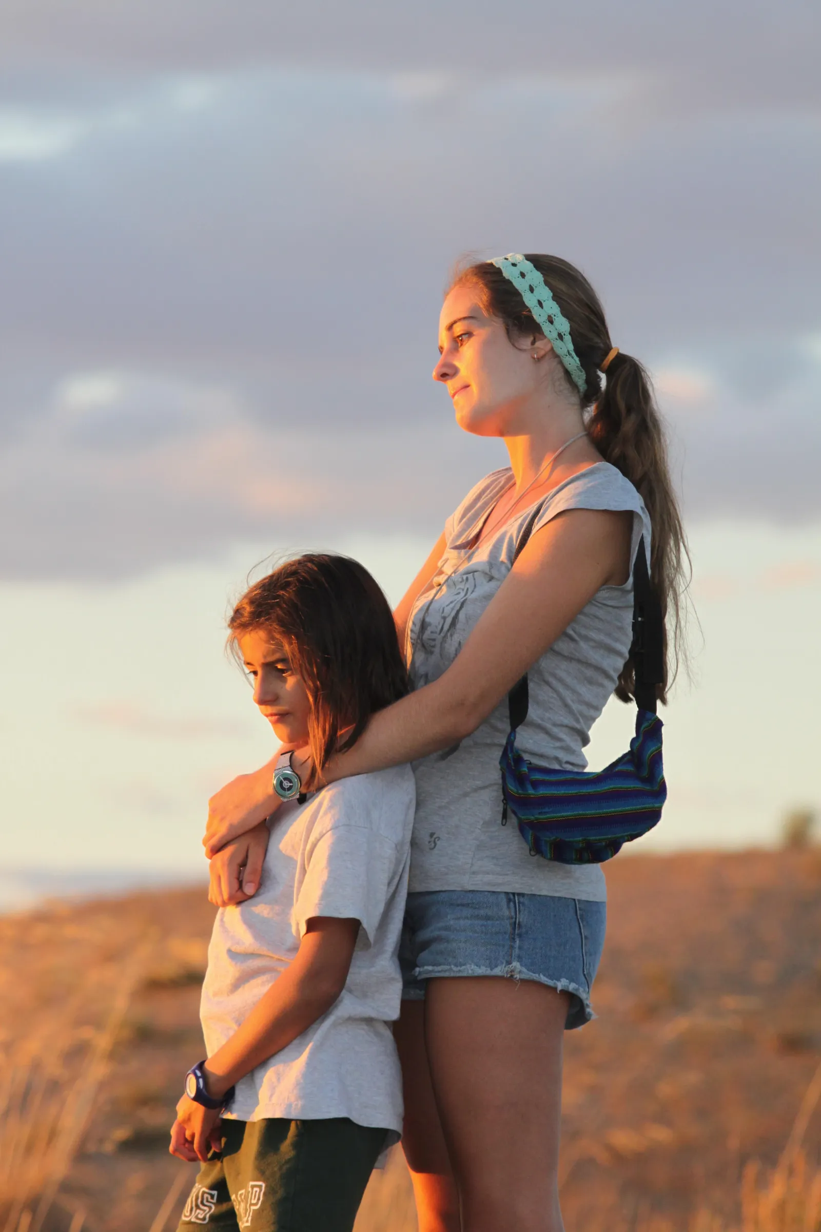 Two campers at sunset at the Toledo camp