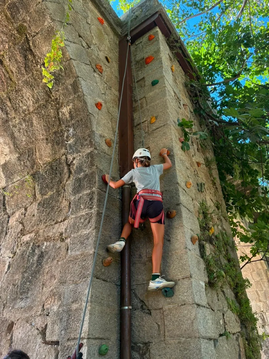 Climbing a stone wall at the Gredos camp